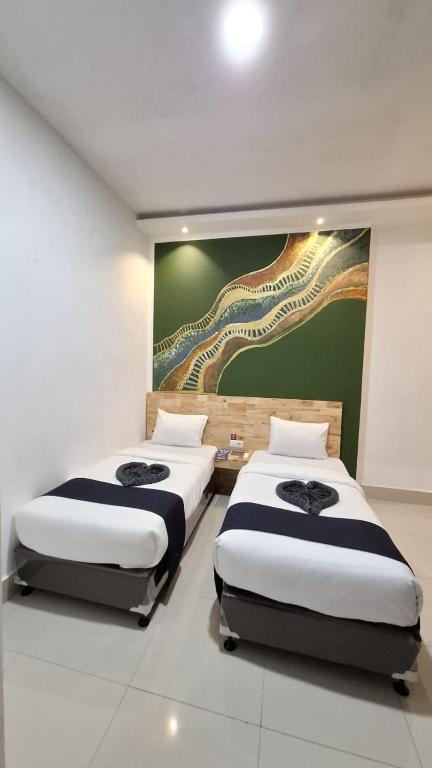 Postel nebo postele na pokoji v ubytování D'Hills Hotel