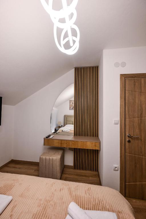 Postel nebo postele na pokoji v ubytování Apartmani EMA SL