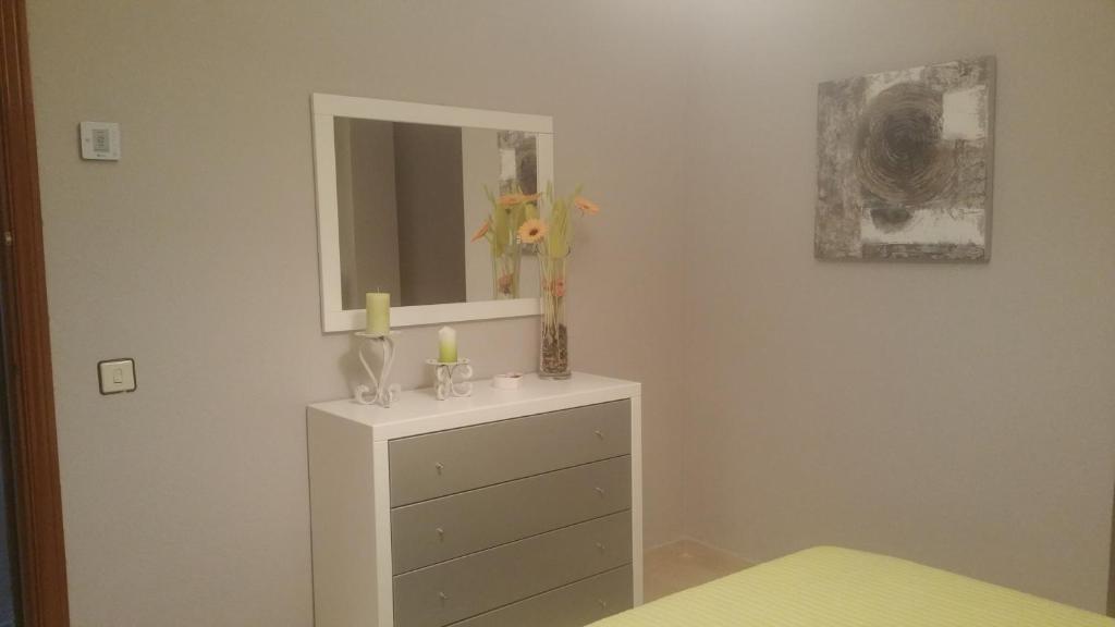 Łóżko lub łóżka w pokoju w obiekcie Apartamento Eduardo Dato