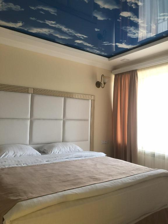 Postel nebo postele na pokoji v ubytování Goris Hotel