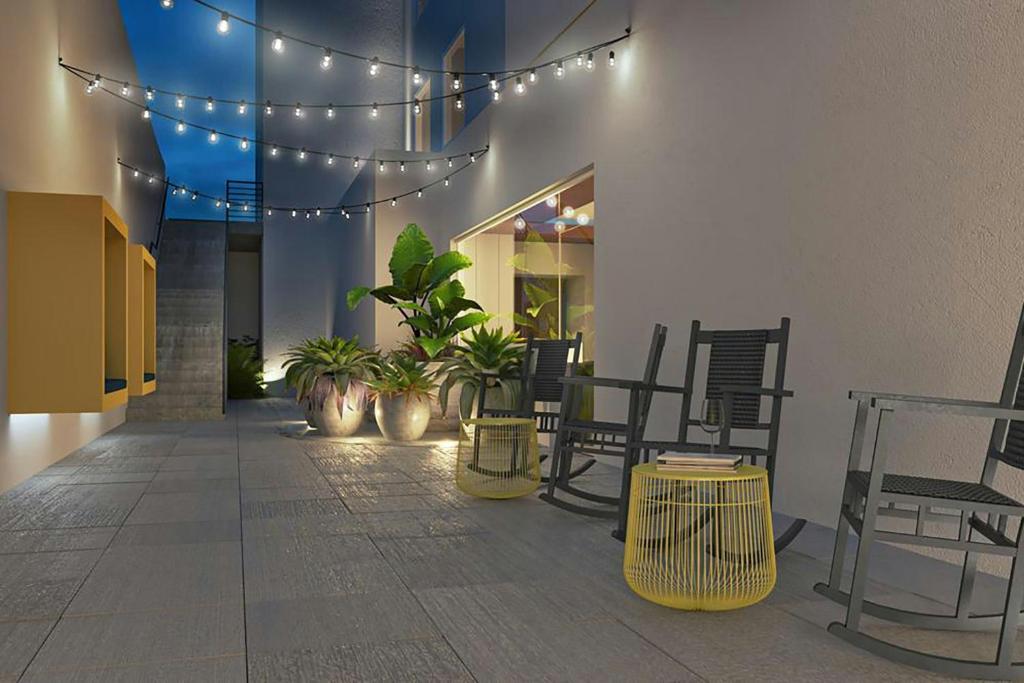 a hallway with plants and lights in a building at Fairfield by Marriott San Jose Airport Alajuela in Alajuela City