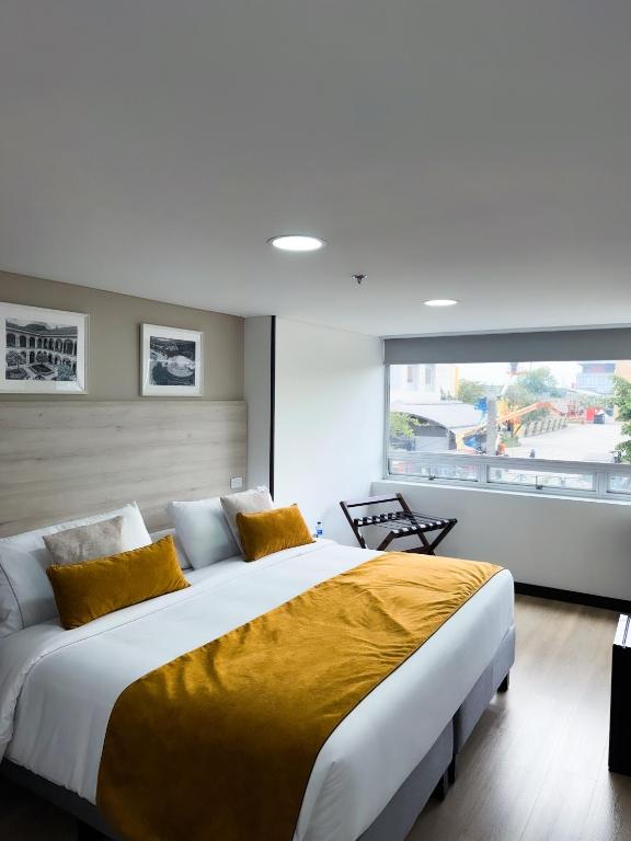 Postel nebo postele na pokoji v ubytování Hotel WLH Gold Bogota