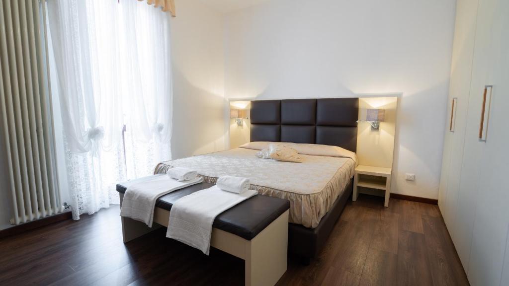 Postel nebo postele na pokoji v ubytování Hotel Sirena