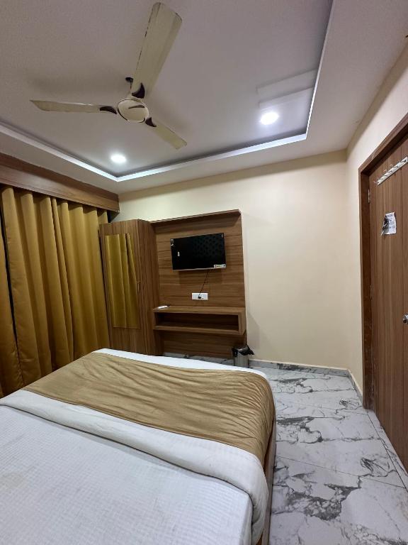 Postel nebo postele na pokoji v ubytování Hotel Royal King