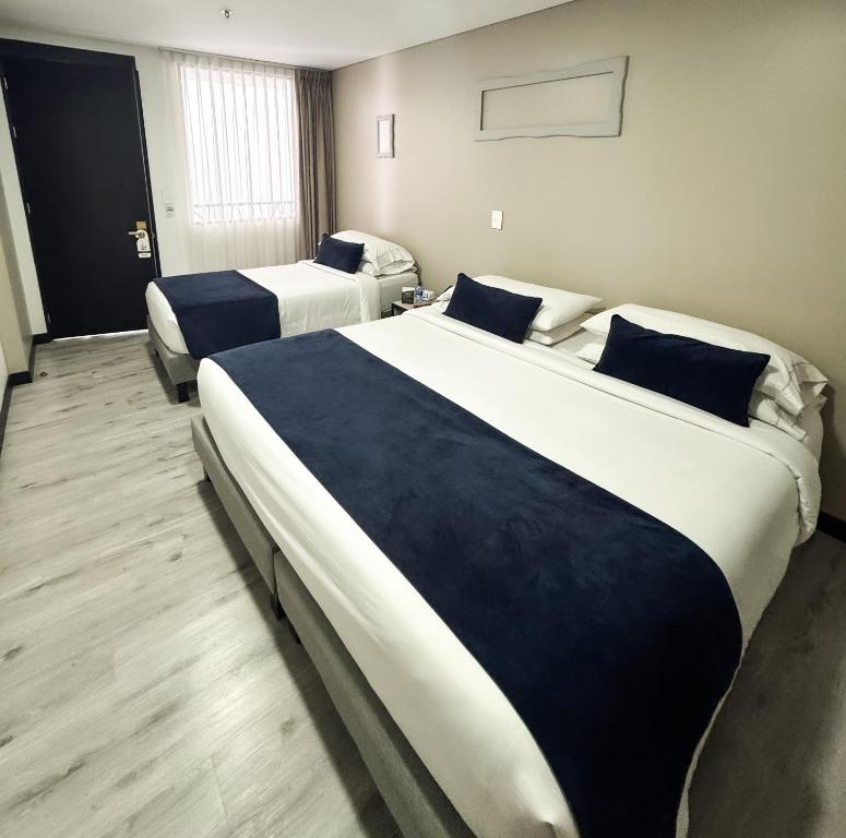 Postel nebo postele na pokoji v ubytování Hotel WLH Silver Corferias