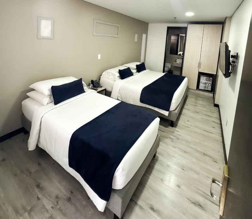 Postel nebo postele na pokoji v ubytování Hotel WLH Silver Corferias