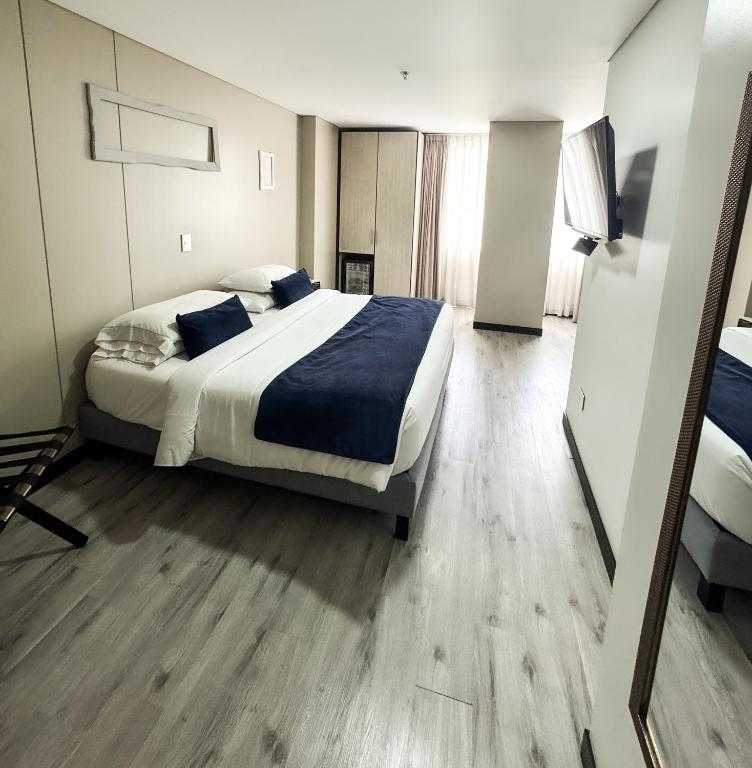 Postel nebo postele na pokoji v ubytování Hotel WLH Silver Corferias
