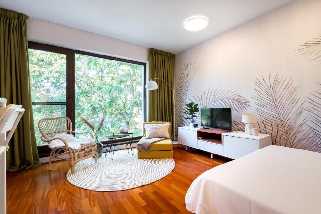 En eller flere senge i et værelse på Urban Jungle