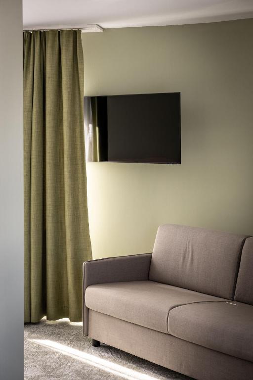 TV a/nebo společenská místnost v ubytování flexymotel Buchs