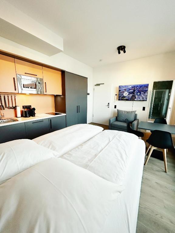 Postel nebo postele na pokoji v ubytování Homaris Apartments Winterhude