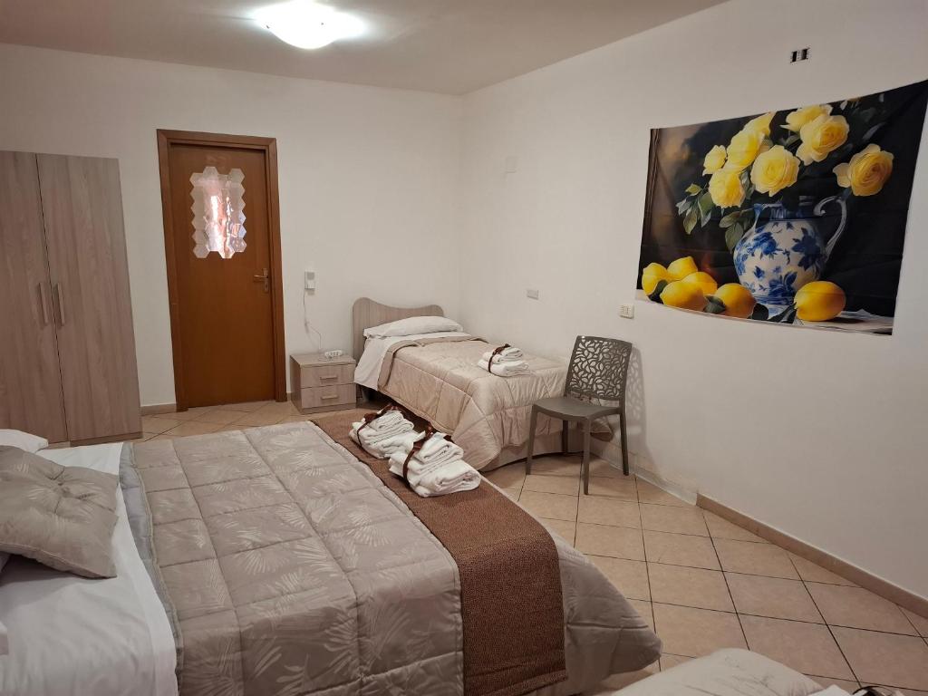 Postel nebo postele na pokoji v ubytování B&B Le Lumìe "Il Cortiletto Del Centro"