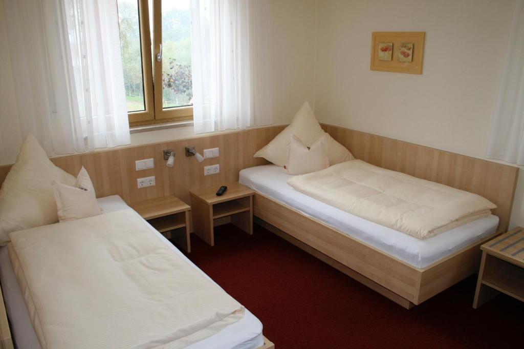 Postel nebo postele na pokoji v ubytování Landhotel Winter