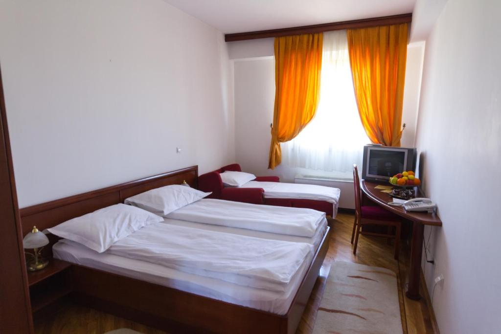Postel nebo postele na pokoji v ubytování Hotel M3