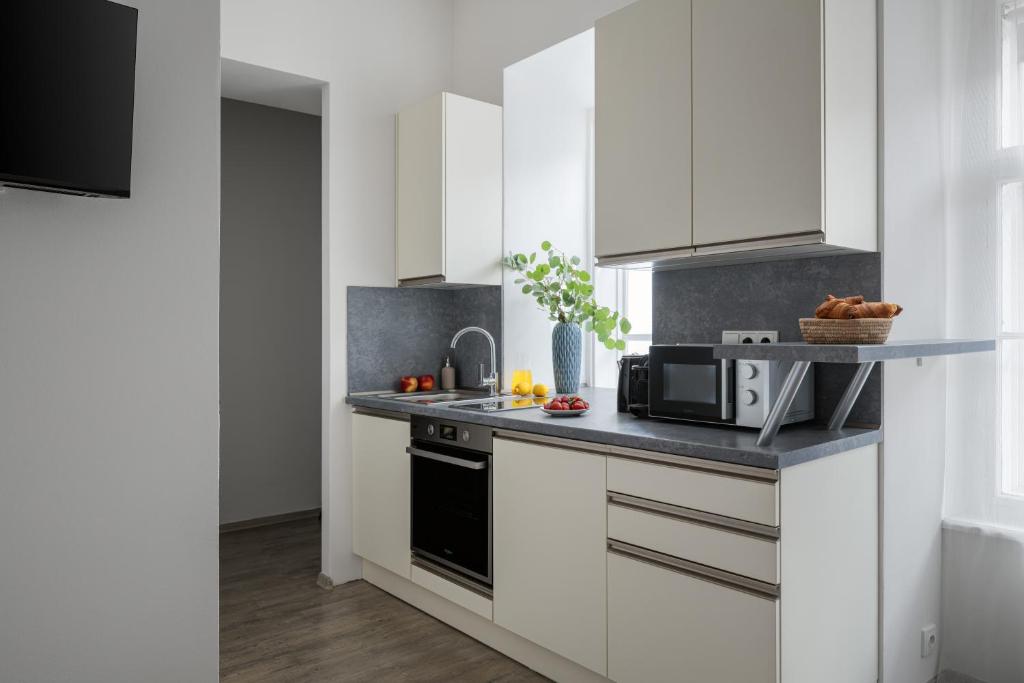 Kuchyň nebo kuchyňský kout v ubytování Enjoy Downtown Boutique Apartments #12 by Goodnite cz
