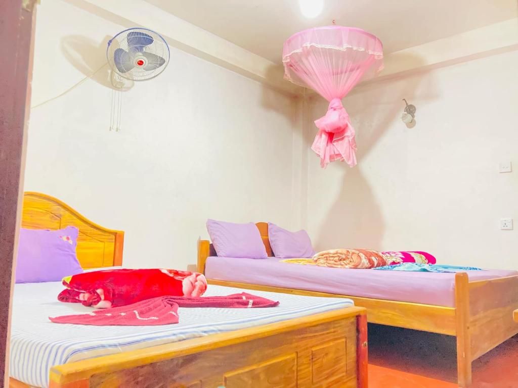 Postel nebo postele na pokoji v ubytování Wild Grass Inn - Ella