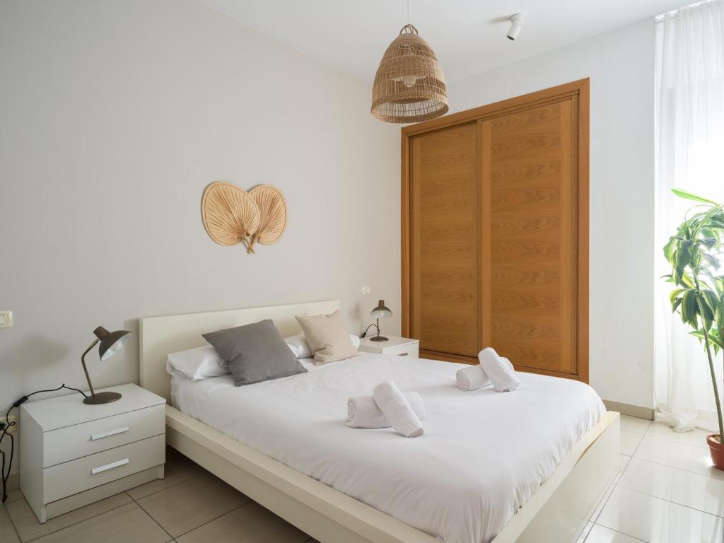 A bed or beds in a room at Remote workers house By CanariasGetaway