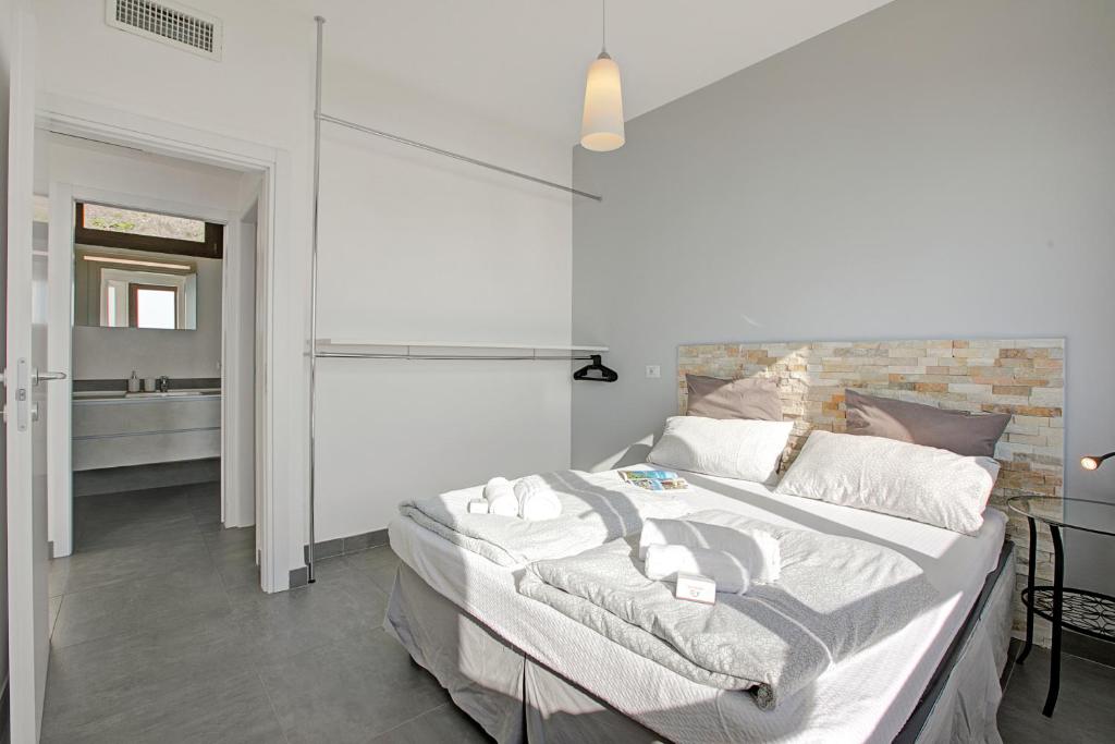 Łóżko lub łóżka w pokoju w obiekcie Casa dei Nonni Apartments