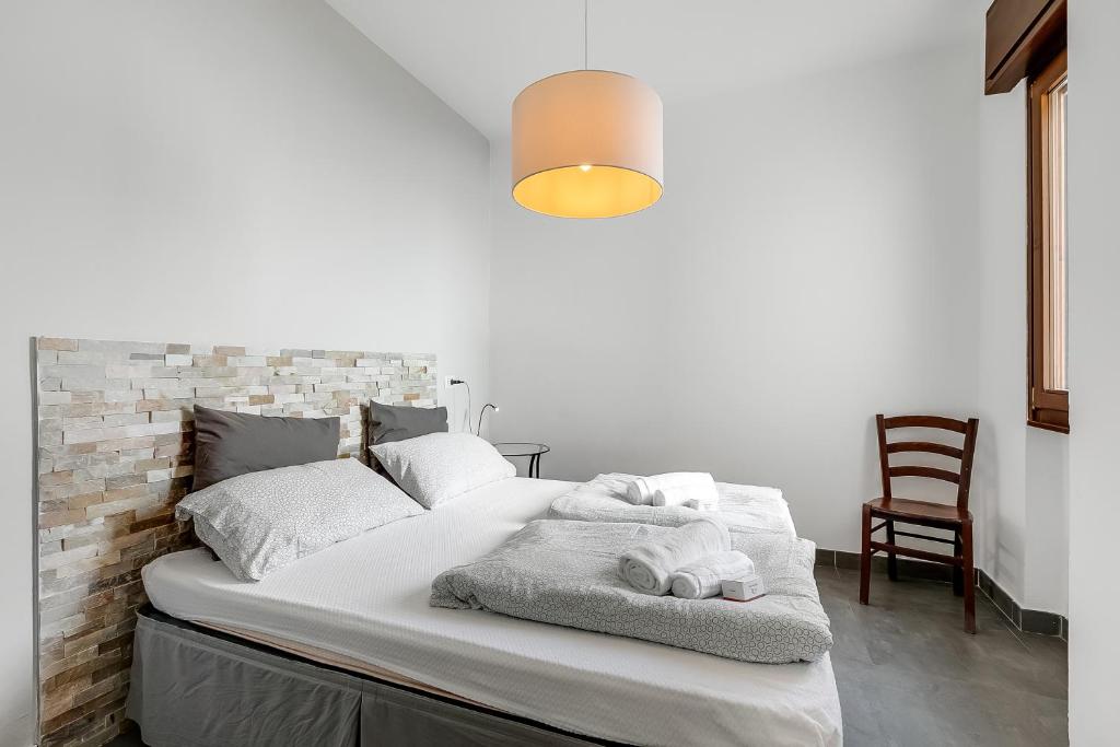 Łóżko lub łóżka w pokoju w obiekcie Casa dei Nonni Apartments