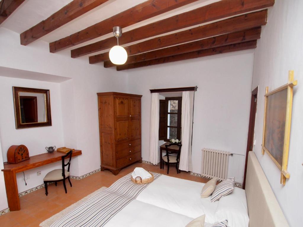 Postel nebo postele na pokoji v ubytování León de Sineu