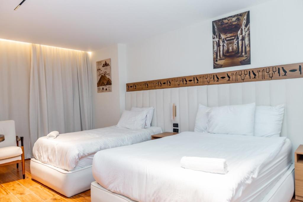 Postel nebo postele na pokoji v ubytování Superior Pyramids Inn