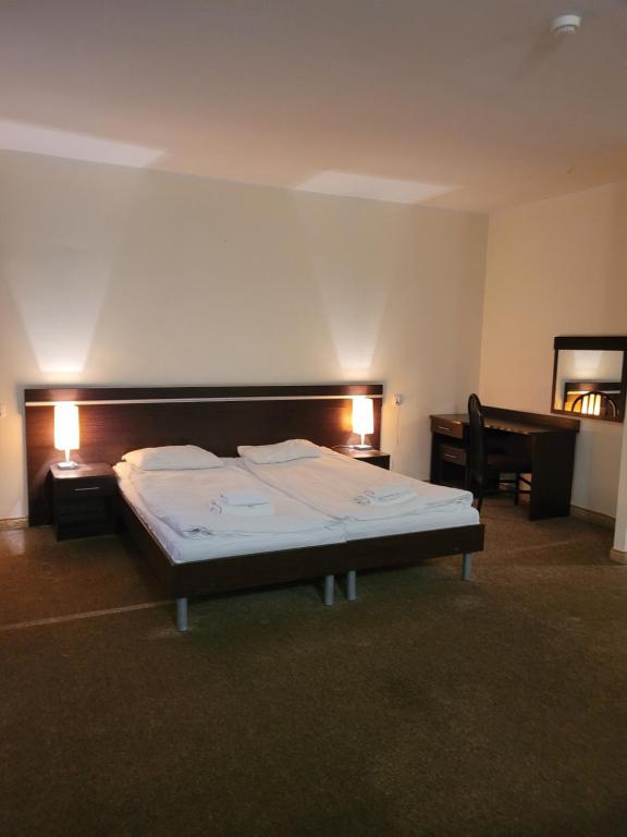 Postel nebo postele na pokoji v ubytování Artel Villa Tarsis