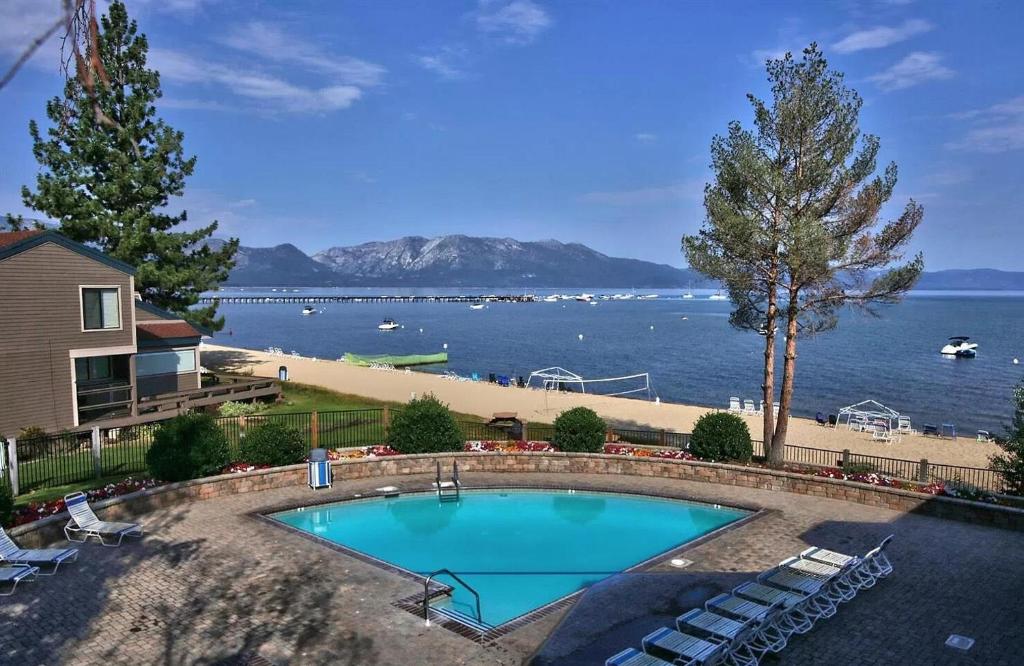 a swimming pool with a view of the water at LLC1236 - Lakeside Landing in South Lake Tahoe