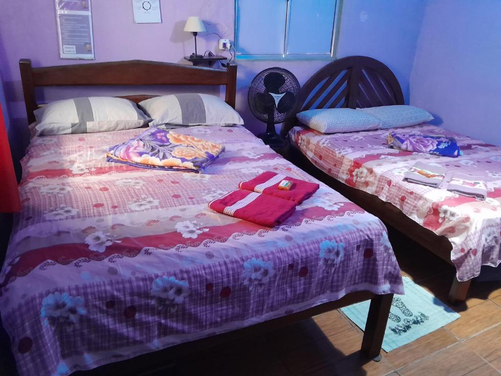 Ένα ή περισσότερα κρεβάτια σε δωμάτιο στο Hospedagem Chapéu Virado
