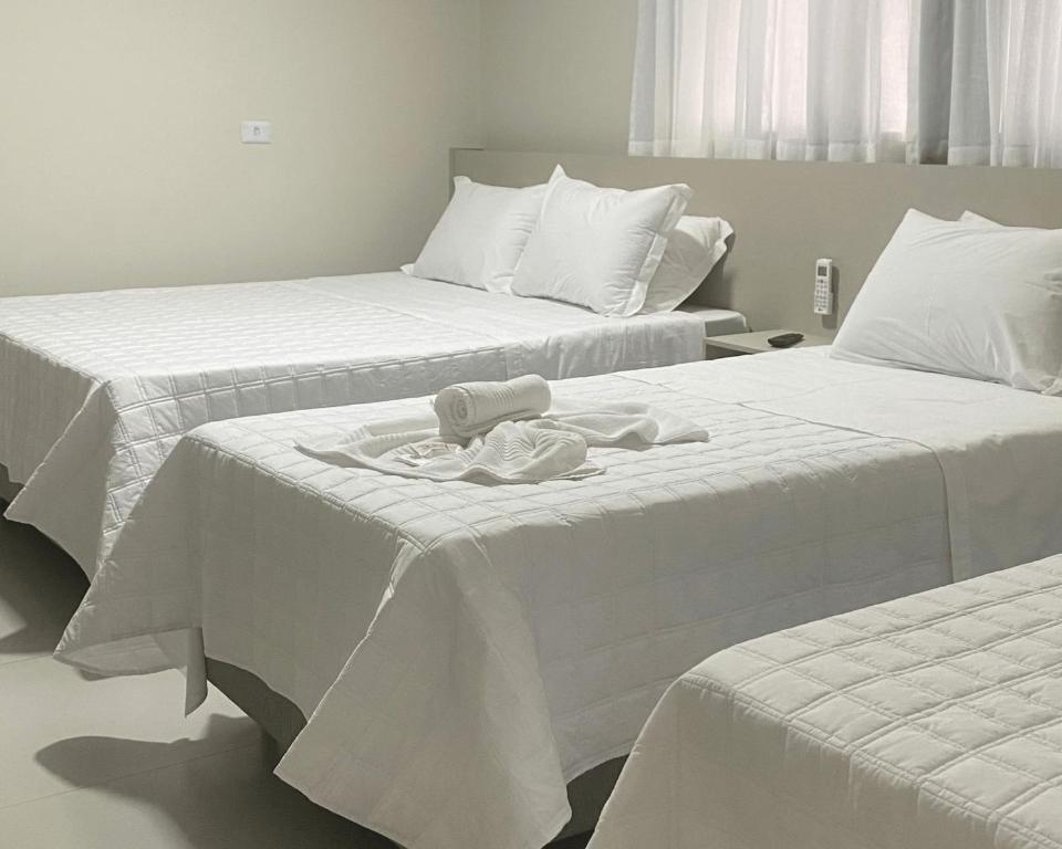 Postel nebo postele na pokoji v ubytování Hotel Marechal Express