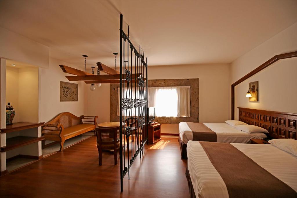 Postel nebo postele na pokoji v ubytování Hotel de Mendoza