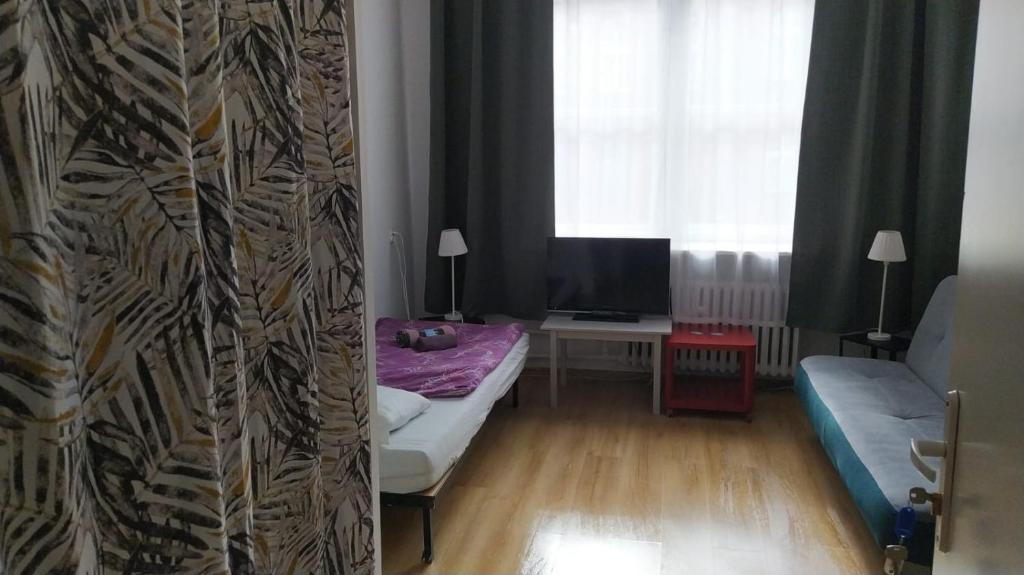 Posteľ alebo postele v izbe v ubytovaní U Szermierzy
