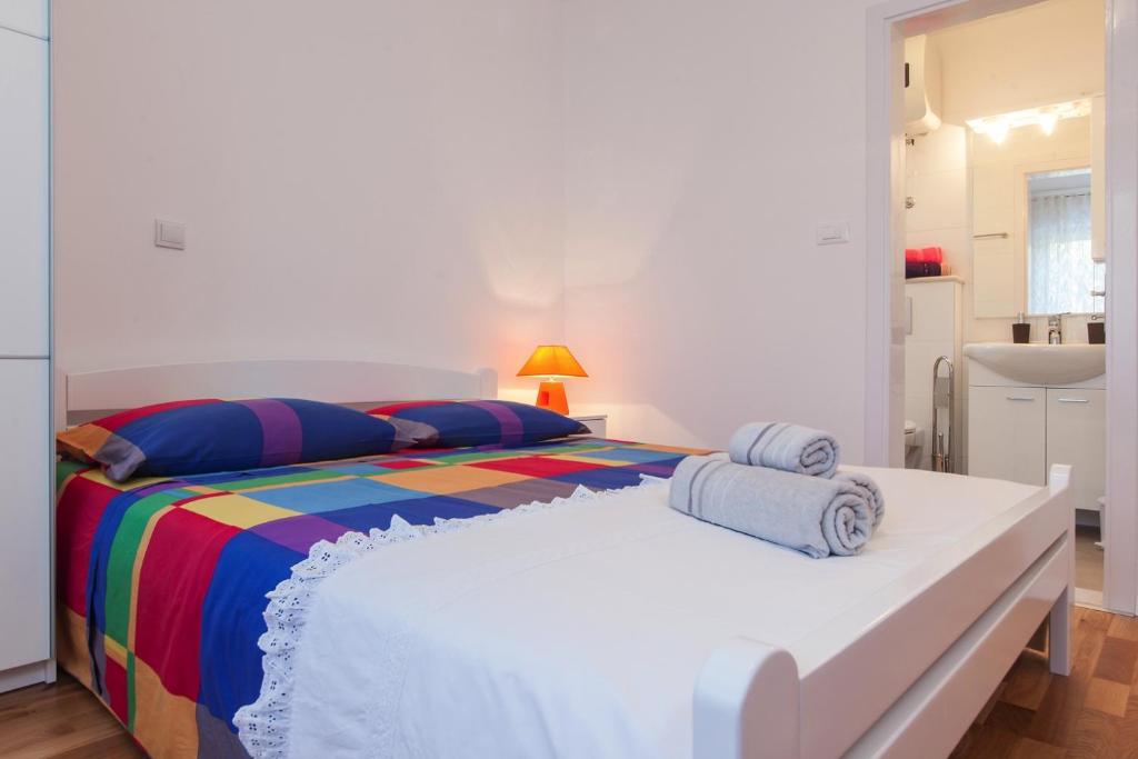 Postel nebo postele na pokoji v ubytování Apartments Filipeti