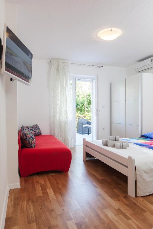 Postel nebo postele na pokoji v ubytování Apartments Filipeti