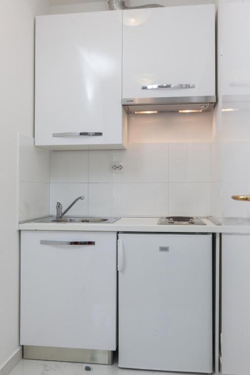 Kuchyň nebo kuchyňský kout v ubytování Apartments Filipeti