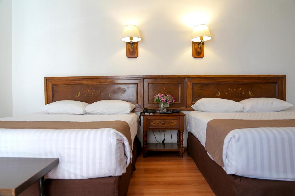 Postel nebo postele na pokoji v ubytování Hotel de Mendoza