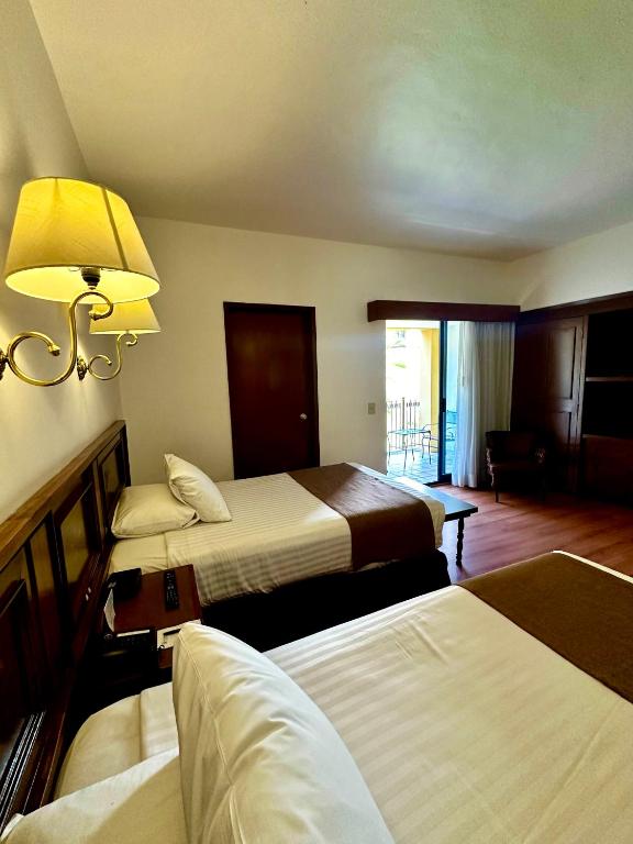 Postel nebo postele na pokoji v ubytování Hotel de Mendoza
