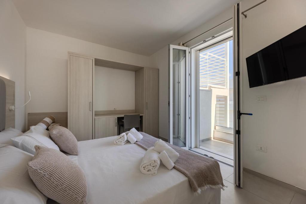 Postel nebo postele na pokoji v ubytování Scirocco Boutique Eco Hotel