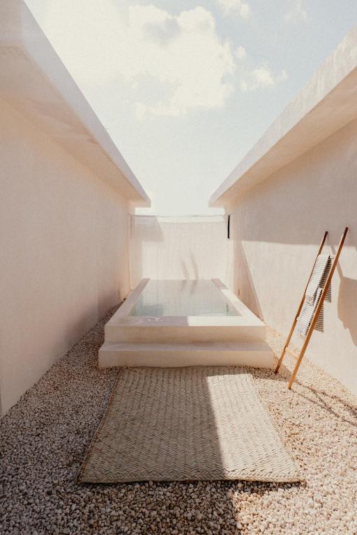 Postel nebo postele na pokoji v ubytování Ixum, Casa Hotel Boutique