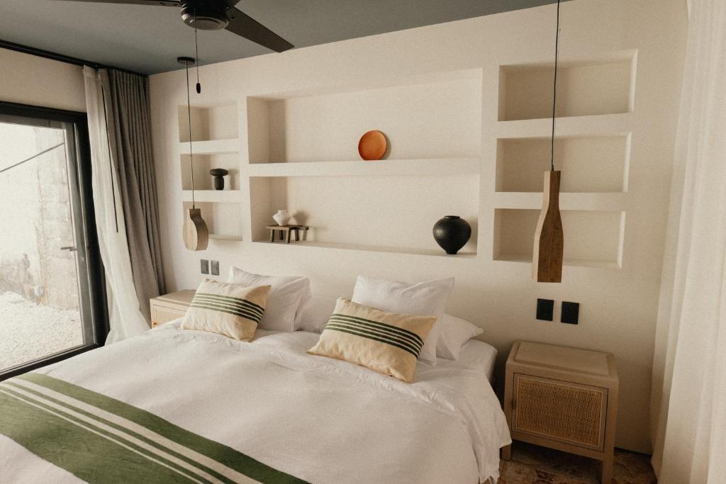 Postel nebo postele na pokoji v ubytování Ixum, Casa Hotel Boutique