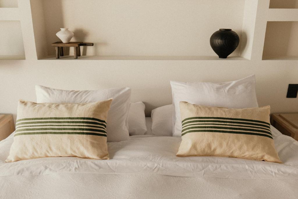 Postel nebo postele na pokoji v ubytování Ixum, Casa Hotel Boutique