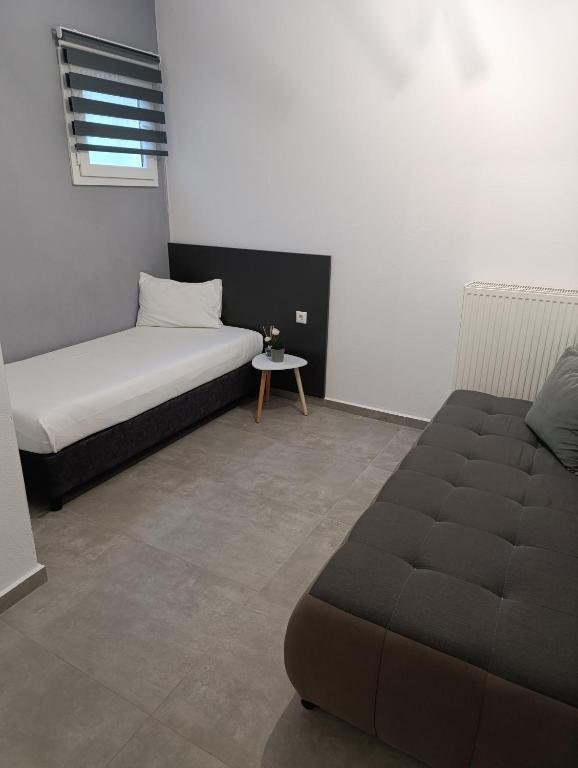 Posteľ alebo postele v izbe v ubytovaní Milias Apartment's