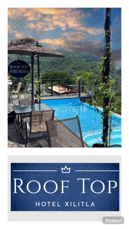 a sign for a hotel with a swimming pool at Rooftop in Xilitla