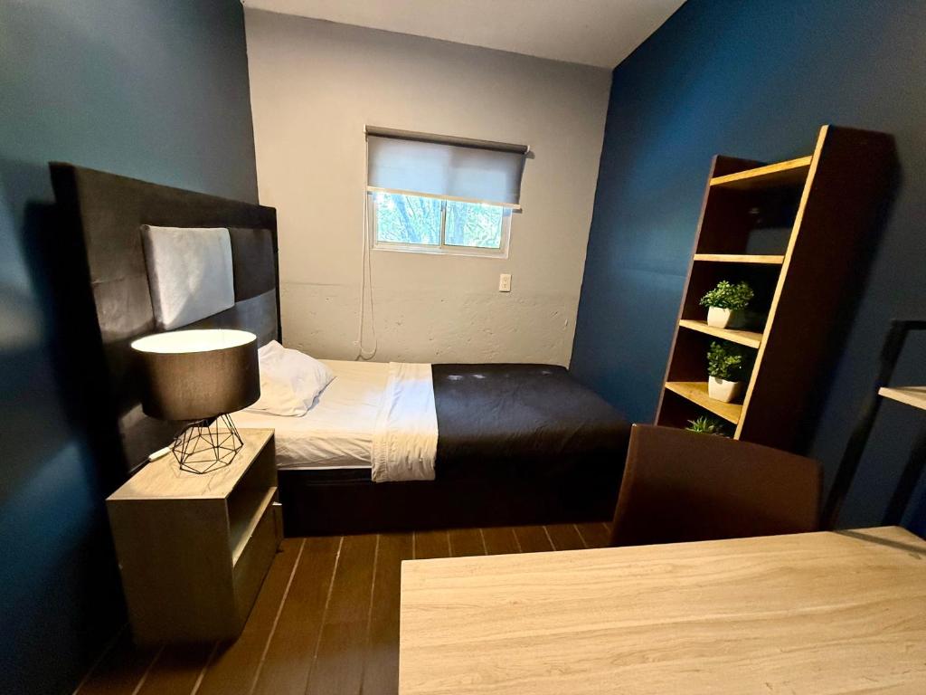 Letto o letti in una camera di RHM Spaces - SantaMaria