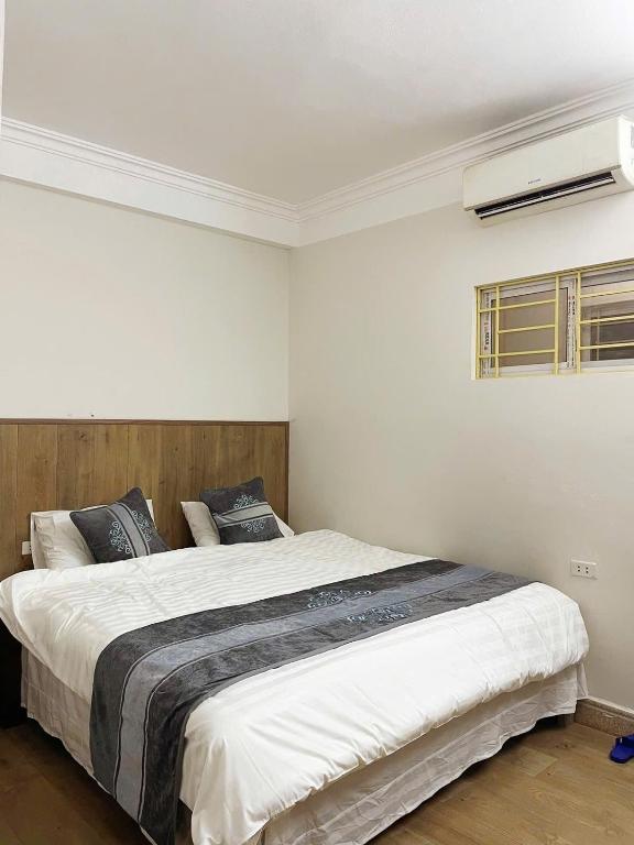 Postel nebo postele na pokoji v ubytování Airy Nest Hotel