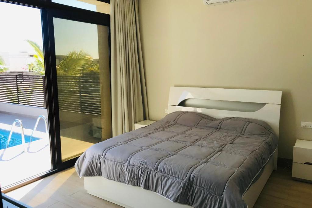 Postel nebo postele na pokoji v ubytování Dream Home Hawana Resort