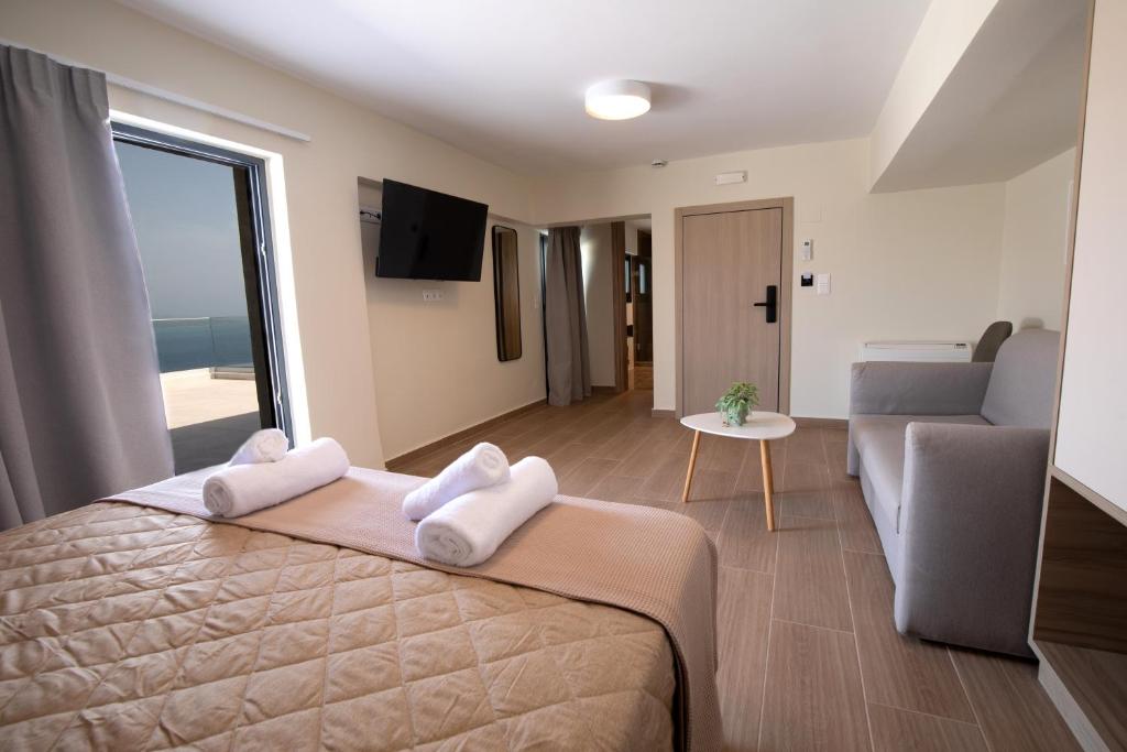 Postel nebo postele na pokoji v ubytování Trinasus Hotel