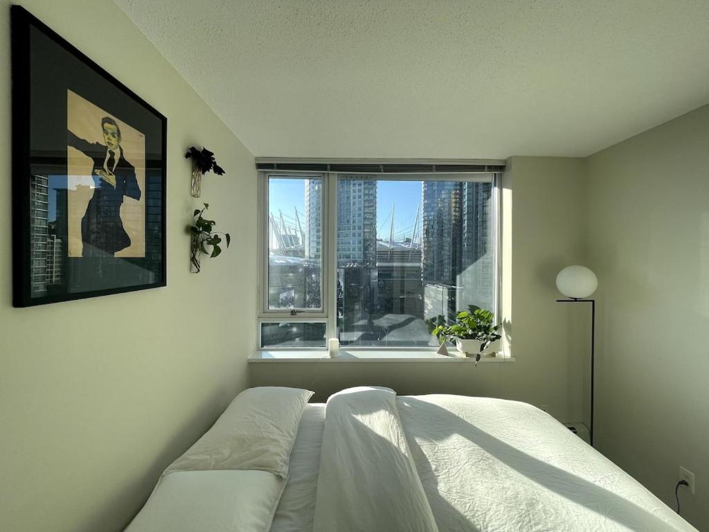 Ένα ή περισσότερα κρεβάτια σε δωμάτιο στο Downtown Apartment