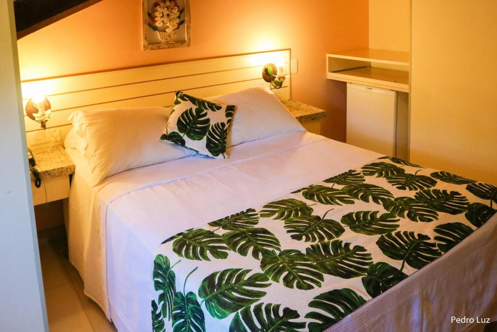 Cama ou camas em um quarto em Hotel Rio Penedo