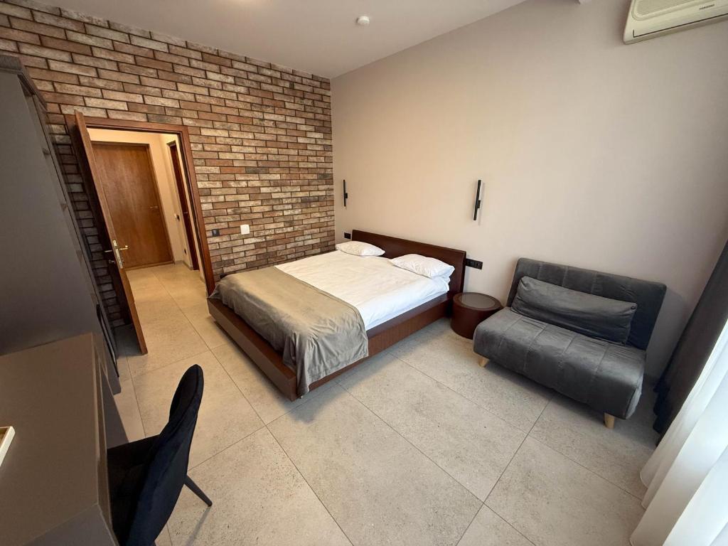 Postel nebo postele na pokoji v ubytování Komilfo Hotel