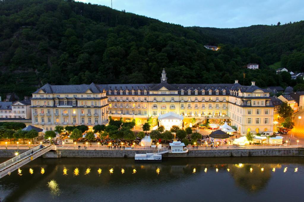 
a large building with a clock tower on top of it at Häcker´s Grand Hotel in Bad Ems
