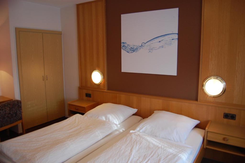Postel nebo postele na pokoji v ubytování Hotel Hubertushof